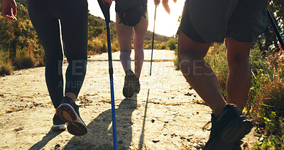 Buy stock photo People, legs and hiking with stick on walking path, trail or outdoor expedition in nature. Back view, hikers or group of friends with backpack on mountain for trekking journey, adventure or exercise
