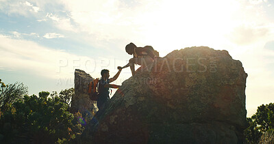 Buy stock photo Friends, helping hand and walking on mountain for countryside, travel or adventure to explore nature. Fitness, people and journey with natural environment for hiker, hobby and bonding together