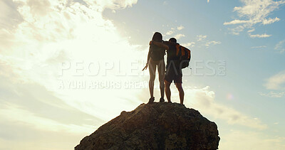 Buy stock photo Couple, hiking and view on rock, mountain and hug with back, low angle and sky on tourism adventure. People, embrace and outdoor for trekking, direction or landmark on trail for holiday in summer