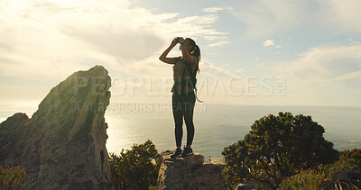 Buy stock photo Woman, binoculars and hiking on mountain, sky and gear for sightseeing, birdwatching or adventure. Person, view and lens for landmark, outdoor and thinking with trekking on trail in summer in Spain