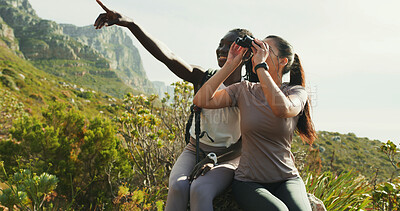 Buy stock photo Happy, women and friends with binocular for hiking, nature sightseeing and mountain view. Smile, people and point for travel, backpacking adventure and birdwatching observation with wildlife search 