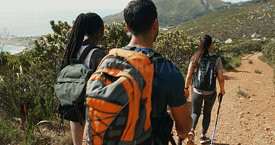 Buy stock photo Friends, group and hiking in nature with backpack for travel, holiday or people walk on vacation. Man, women or back view with trekking pole for adventure, expedition or explore mountain path outdoor