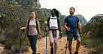 Friends, holiday and hiking stick in nature for travel, walking and group vacation together. Man, women and outdoor with trekking pole for adventure, expedition or explore mountain path on journey
