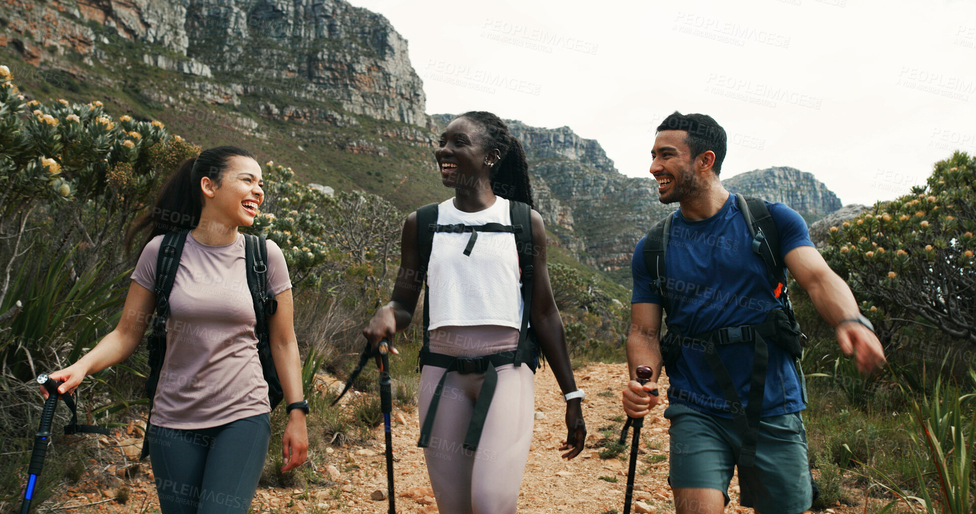 Buy stock photo Friends, hiking and laughing in nature for travel, walking and group talking on vacation. Man, women and outdoor with trekking pole for adventure, funny joke and explore mountain path on journey