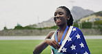 Runner, girl and medal with USA flag, smile or excited for success with goals at global event. Black woman, athlete and champion with national pride, achievement or sport contest at stadium in summer