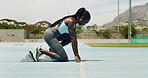 Black woman, athlete and training with starting blocks, track and profile for launch, speed and race. Person, girl and runner at line for exercise, workout and fitness at sports club in Jamaica