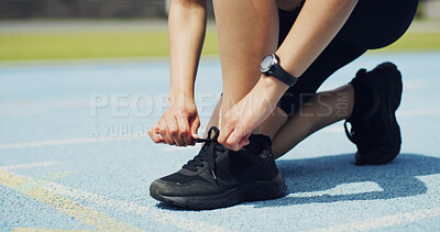 Buy stock photo Fitness, shoes and hands of person on track for running, workout or training for race outdoor. Sports, challenge and feet of athlete typing laces for exercise, marathon or competition at stadium.