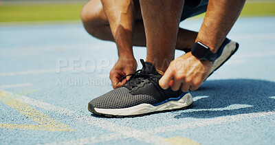Buy stock photo Running, shoes and hands of person on track for fitness, workout or training for race outdoor. Sports, challenge and feet of athlete typing laces for exercise, marathon or competition at stadium.