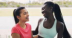 Conversation, fitness and hug with women in stadium for sports competition or tournament. Exercise, health and wellness with happy athlete friends embracing in venue for running, training or workout