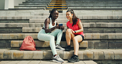 Buy stock photo Runner, phone and relax with friends in stadium for training schedule, team and sports stats. Fitness app, competition, lap times and exercise guide with women on race track for tracking progress