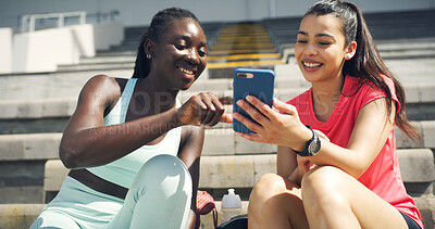 Buy stock photo Runner, phone and typing with friends at stadium for training schedule, team and sports stats. Fitness app, competition, lap times and exercise guide with women on race track for tracking progress