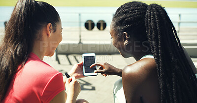 Buy stock photo Runner, phone screen and scroll with friends in stadium for training schedule, team or sports. Fitness app, communication and exercise guide with women on race track for social media and online chat