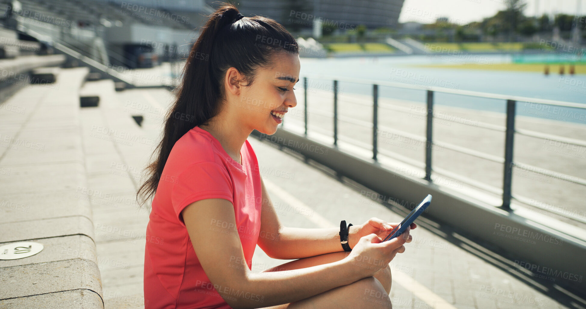 Buy stock photo Athlete, woman and relax with phone at stadium for social media, fitness app and event agenda. Female person, resting and mobile for texting, sports progress results and information for tournament