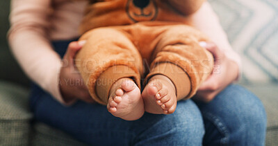 Buy stock photo Parent, hands and sofa with baby feet for childcare growth, youth or development in home. Closeup, parenthood or childhood with infant toes or footprint for love, support or health and wellness