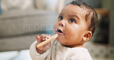 Buy stock photo Eating, cute and cookie with baby in home for teething biscuit, nutrition and calcium snack for growth. Food, weaning rusk and healthy diet with hungry kid in living room of house for development