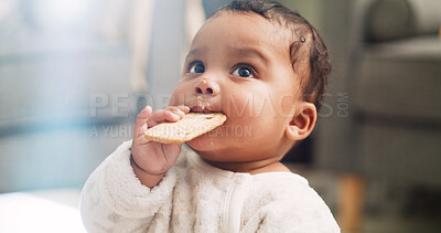 Buy stock photo Food, cute and cookie with baby in home for teething biscuit, nutrition and calcium snack for growth. Eating, weaning rusk and healthy diet with hungry kid in living room of house for development