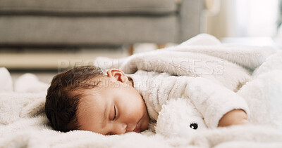 Buy stock photo Baby, teddy bear and sleeping on blanket in home for resting, morning routine or child development. Peaceful, infant and nap on lounge floor for healthy growth, dreaming and comfortable in apartment