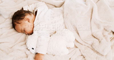 Buy stock photo Tired, baby and sleeping with teddy bear in home for resting, nap routine and child development. Above, infant and dreaming on blanket in nursery for healthy growth, relax and comfortable on bedding