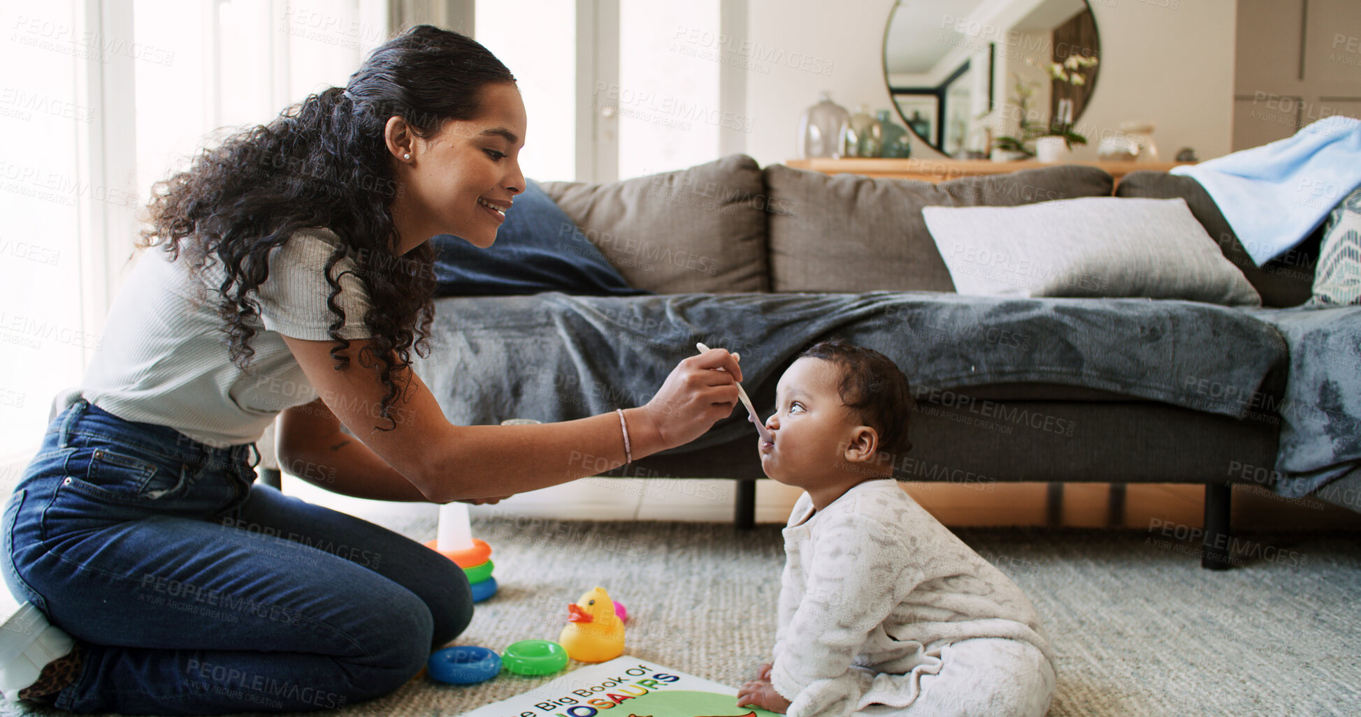 Buy stock photo Mother, play and feeding baby in home for nutrition, growth and wellness with bonding on floor. People, mom and infant child with love, health or eating food for diet in living room at family house