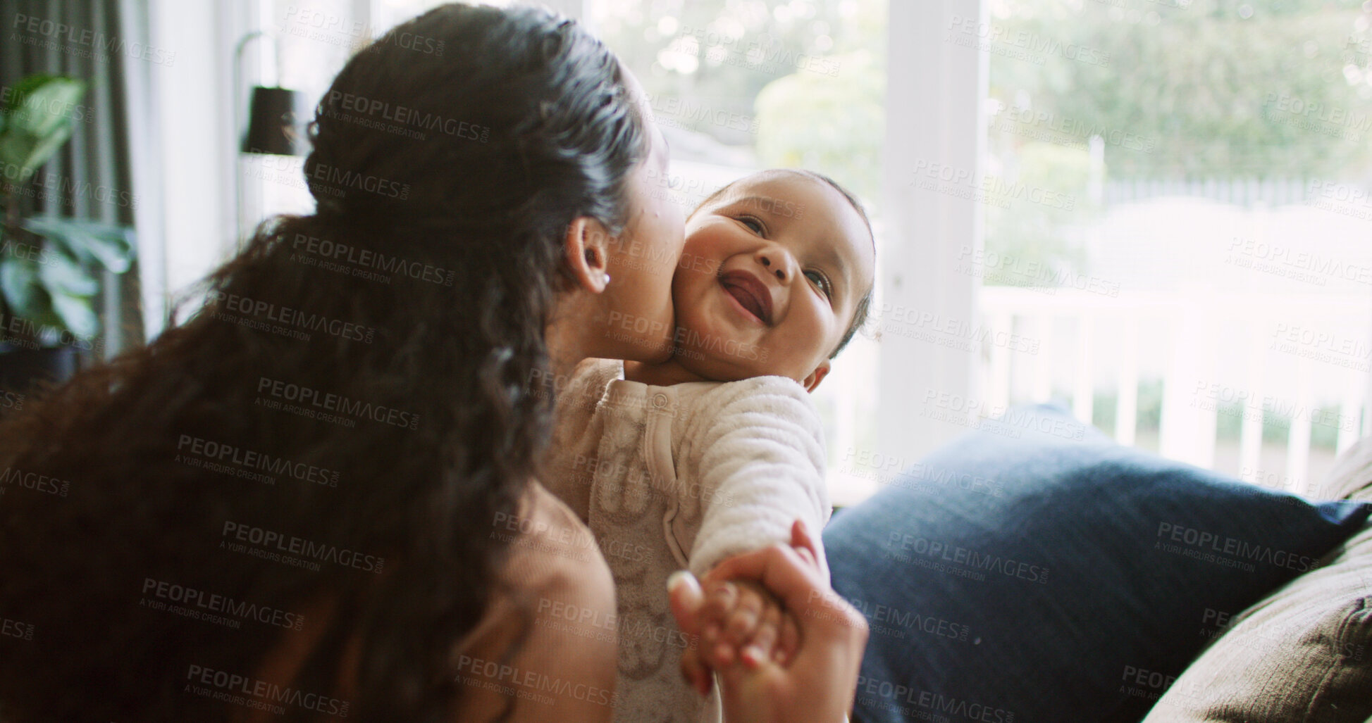 Buy stock photo Kiss, playing and mom with baby in home for bonding, loving relationship and child development. Family, living room and happy infant with mother for support, affection and relax together on sofa