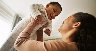 Buy stock photo Happy, playing and mom lift baby in home for bonding, child development and relationship. Family, parenting and mother with infant for laughing, relax and care for love, connection and affection