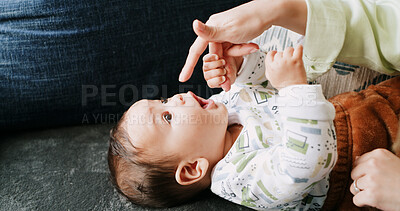 Buy stock photo Hands, playing and mom with baby in home for fun, child development and relax for bonding. Family, house and parent with kid on sofa for love, relationship and happy for support, care and affection