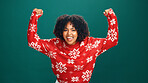 Christmas, excited and portrait of black woman in studio for tradition, festive or celebration. Happy, cheering and face of African female person with good news for xmas party by green background.