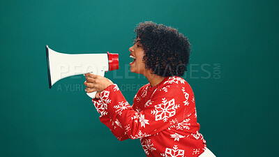 Buy stock photo Woman, Christmas and shout with loudspeaker in studio, happy and profile with announcement on background. Girl, smile and festive celebration with xmas sale, bullhorn and holiday season with voice