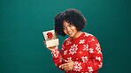 Woman, Christmas and shake present in studio, listen and happy with mock up space on background. Girl, smile and xmas celebration with package, guess and jersey with gift box for holiday season