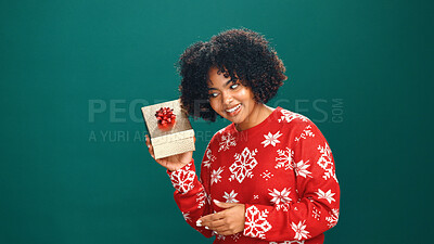 Buy stock photo Woman, Christmas and shake present in studio, listen and happy with mock up space on background. Girl, smile and xmas celebration with package, guess and jersey with gift box for holiday season