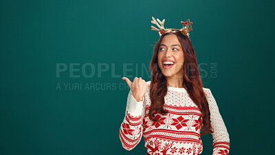 Buy stock photo Studio, pointing and woman with smile, Christmas and happy for holiday discount or green background. Excited, person and direction of presentation, mockup space and show xmas offer or festive season