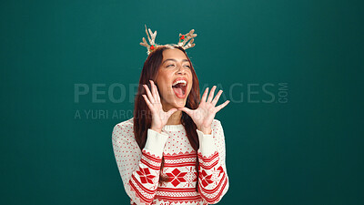 Buy stock photo Shouting, woman and announcement for Christmas, studio or awareness for holiday discount or festive. Green background, space and attention for xmas special, person and screaming for December deals