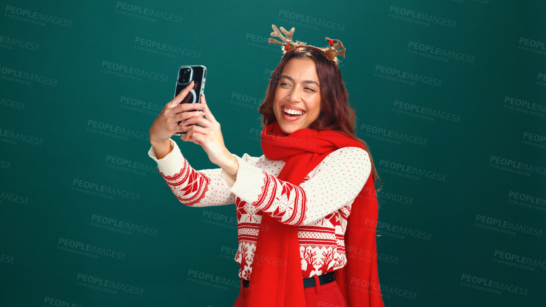 Buy stock photo Christmas, woman or happy with selfie in studio for holiday memory, festive fashion or online post. Mockup space, girl or smile with photography on green background for xmas party and profile picture