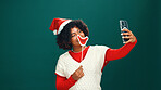 Woman, Christmas and happy for selfie in studio with lips, emoji or hat with mockup space on background. Person, influencer and smile for photography, profile picture or social media for xmas holiday