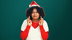 Christmas, fingers crossed and woman in studio, wish and winning with faith on green background. Xmas, space and person with hand gesture, excited and miracle with hope, holiday season or eyes closed