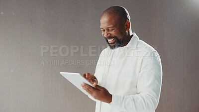 Buy stock photo Mature businessman, tablet and wall at office, smile and scroll with mockup space for contact on web. African person, editor and writer with application, happy and report with article at media agency