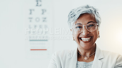 Buy stock photo Mature woman, optometrist and portrait at clinic with smile, glasses and chart for eyesight assessment. Person, optician and happy with pride, confidence and eye care services for vision in Mexico