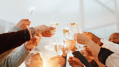 Buy stock photo Hands, champagne toast and success at office, achievement or low angle with sparkler at party. Business people, glass and team goal with alcohol, winning or celebration with profit increase at agency