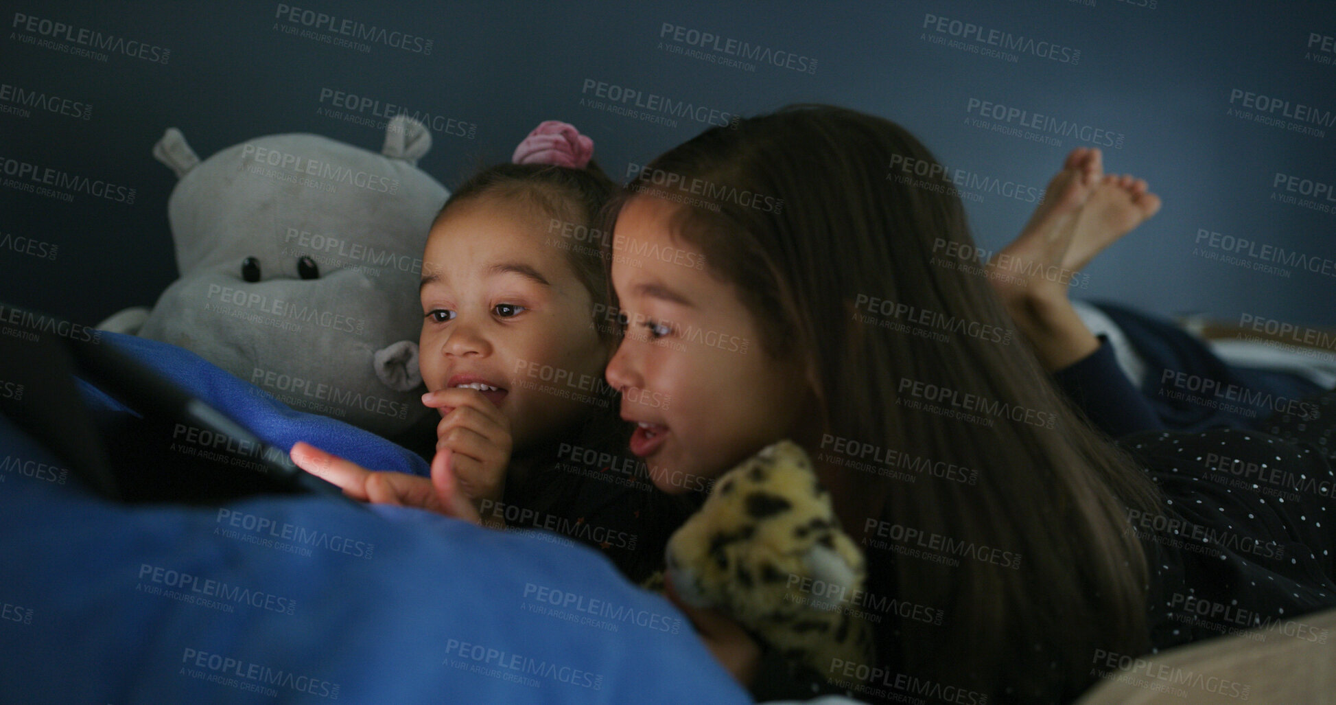 Buy stock photo Relax, tablet and children in bedroom for movie, film or video on app for entertainment together. Bonding, night and sisters watching show on streaming website with digital technology in home.