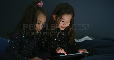 Buy stock photo Relax, tablet and children in bedroom for show, film or video on app for entertainment together. Bonding, night and sisters watching movie on streaming website with digital technology in home.
