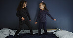 Jumping, smile and adhd with kids on bed for hyperactivity, playful and bonding. Sensory stimulation, dancing and entertainment with children in bedroom of home for funny, energy and game together