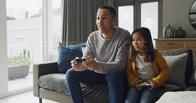 Buy stock photo Father, kid and play video game in lounge for competition, contest and entertainment on sofa. Happy dad, girl and child with console to challenge parent, hobby and relax together with family in home
