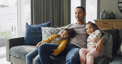 Buy stock photo Children, father and smile on sofa with hug, bonding together and love for watching TV in home. Movie, couch and happy man with girls in living room with family, relax and embrace with dad in house