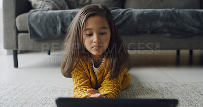 Buy stock photo Tablet, relax and floor with child in home for streaming service, education games and elearning app. Kindergarten cartoons, storytelling subscription and search with girl in living room for study