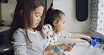 Cleaning, washing dishes and help with kids in kitchen for hygiene, support or domestic chores. Bacteria prevention, sanitary or housekeeping with siblings or children in family home for maintenance