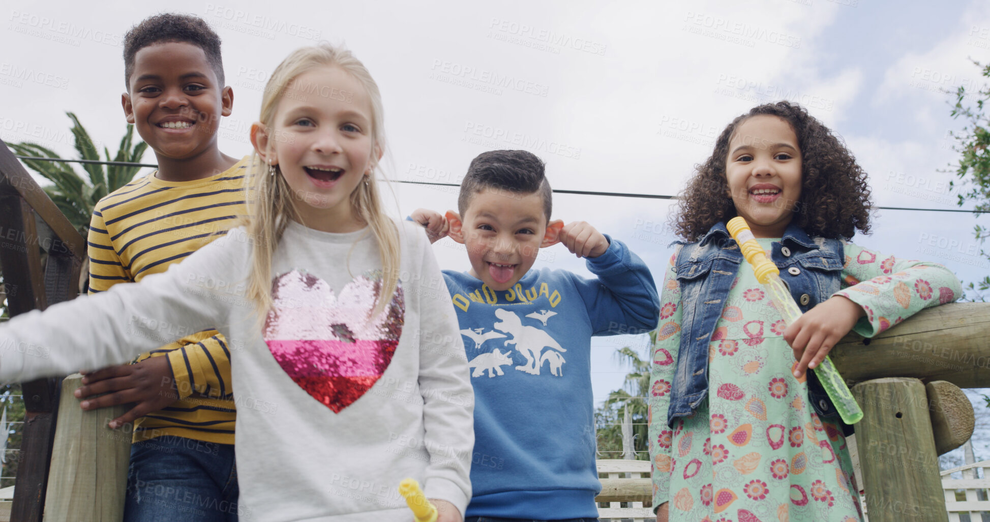 Buy stock photo Portrait, happy kids and friends laughing at playground with bubble toys, funny face and goofy. Girls, boys and group of playful children with tongue out, silly and smile outdoor together at park