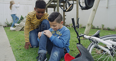 Buy stock photo Bike, checking and crash with kids on playground together for accident concern, help or worry. Fall, mistake and physical injury with children friends outdoor in park for care, comfort or consoling