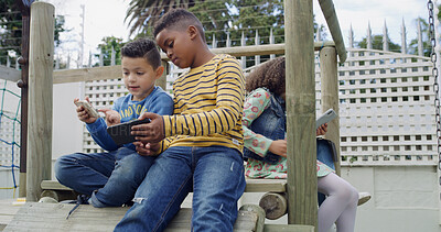 Buy stock photo Playing, friends and boys at playground with phone for having fun, bonding and online games. Youth, childhood and kids on smartphone at outdoor park for adventure on holiday, weekend and vacation