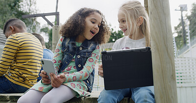 Buy stock photo Friends, children and smile with tech in park for social media, fun and break in backyard. Girls, together and bonding with phone, tablet and internet for school holiday in playground with games