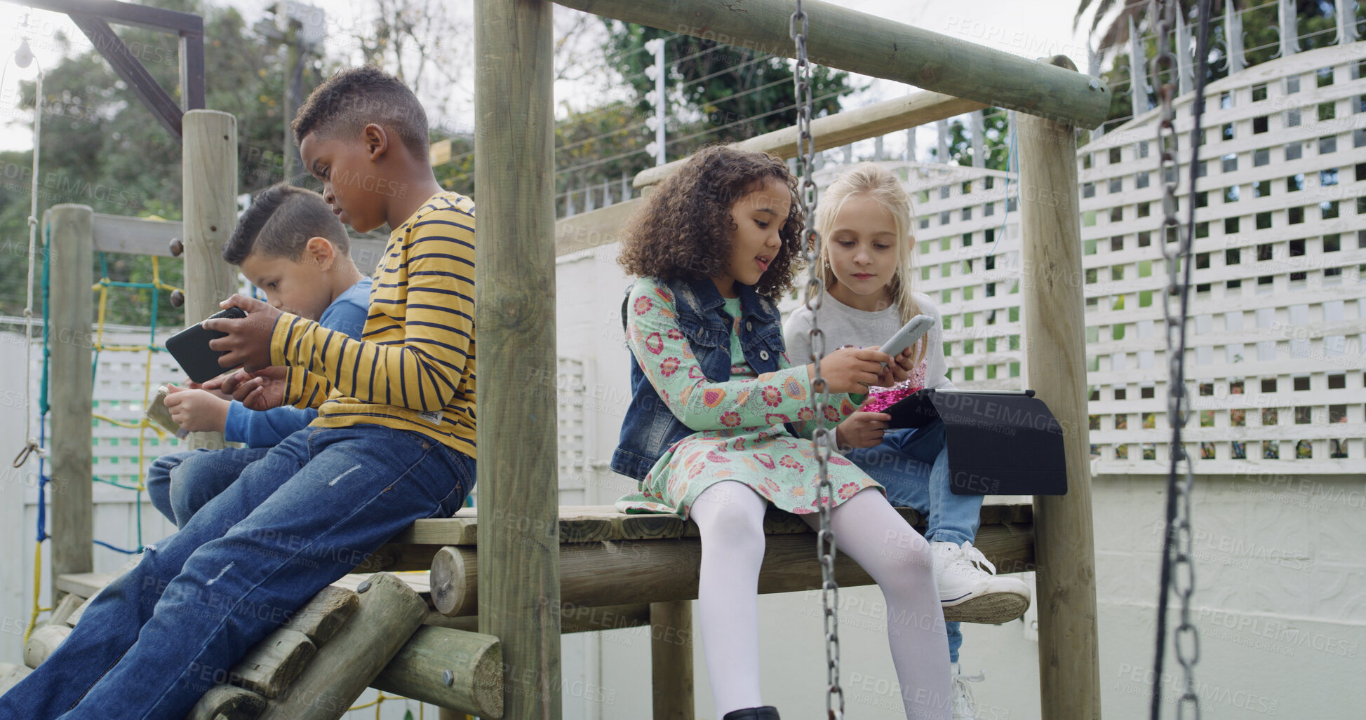 Buy stock photo Playground, happy and children with tech in park for bonding, playing and online games. Weekend, friends and kids with phone, tablet and internet for connection, entertainment and media in backyard